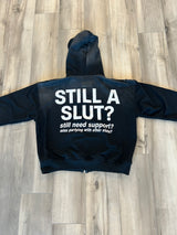 BLACK-STILL A SLUT ZIP UP